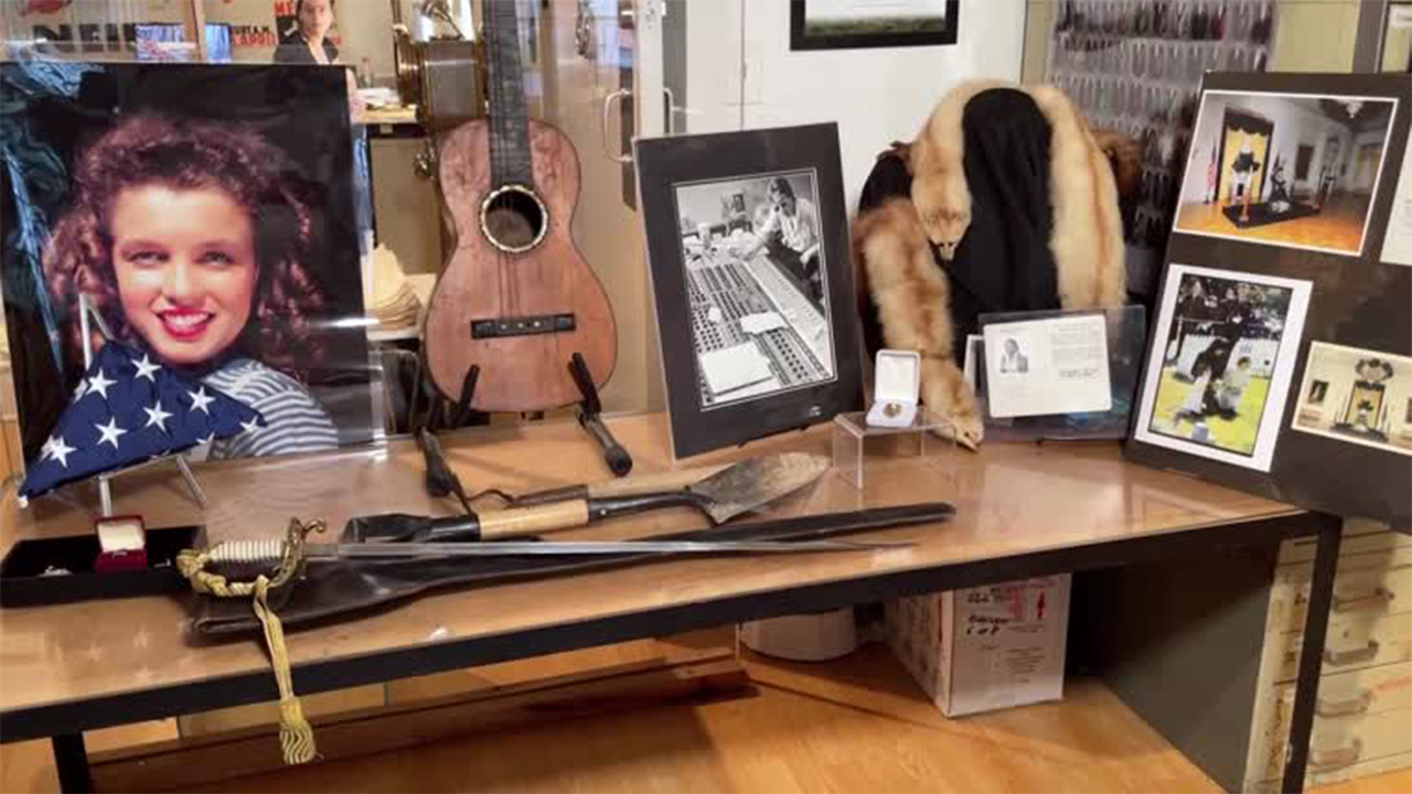 Elvis Presley jewelry, guitar up for auction