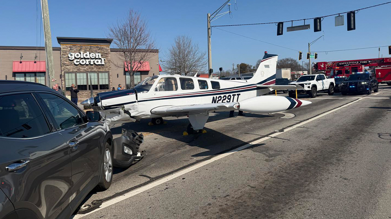Small plane crashes into several cars during emergency landing, multiple injured